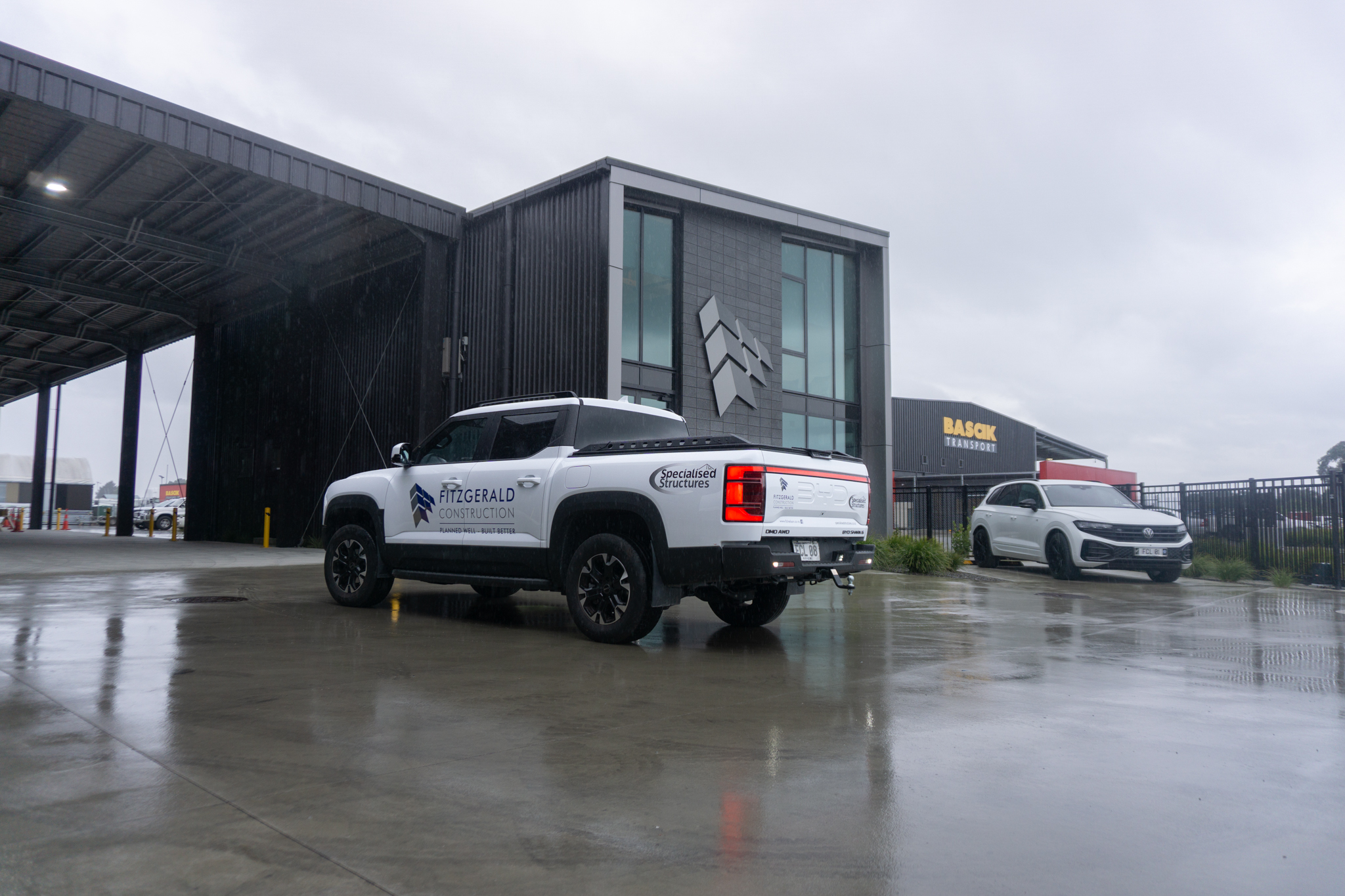 BYD Shark 6 with Fitzgerald Construction branding in front of the Fitzgerald Construction business premises