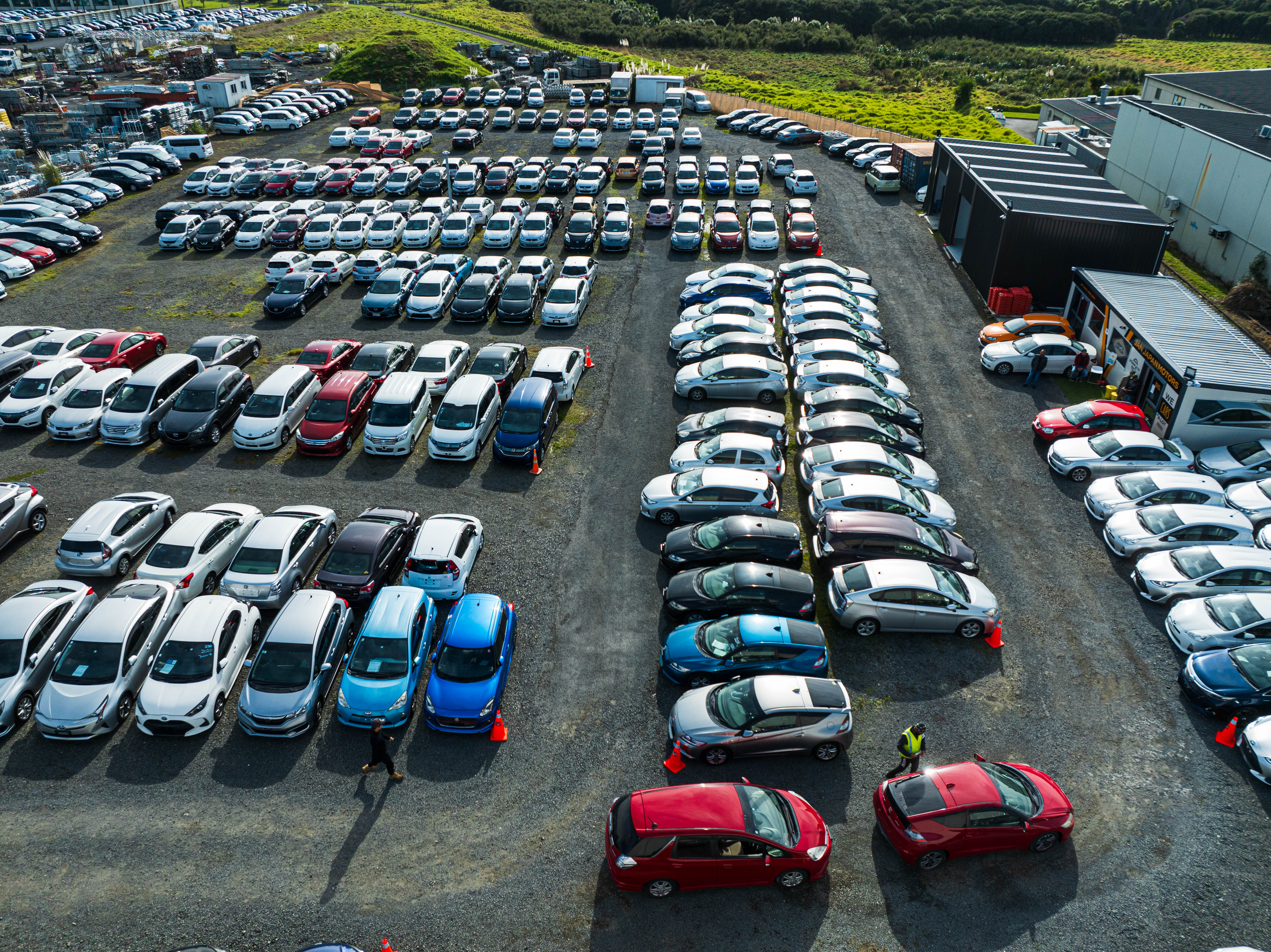 Aerial view of Jan Japan Motors Ltd yard showcasing hundreds of high-quality used Japanese import cars ready for sale.